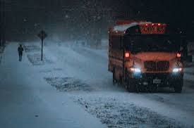 School bus in snow at night